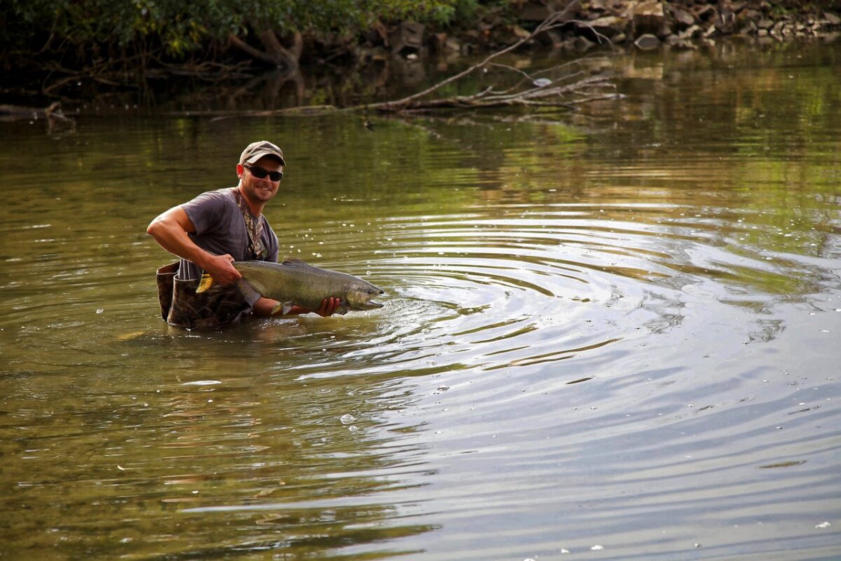 A Guide to Fly Fishing in Kenya 5 Man with a huge fish in a lake